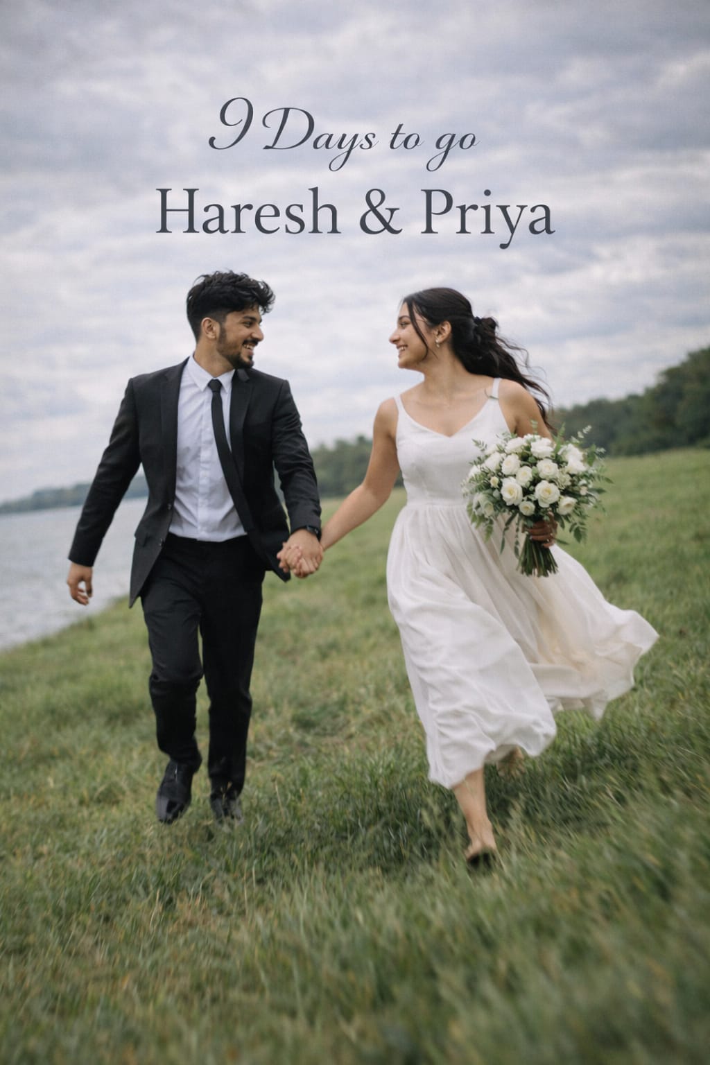 Pre wedding photo prompt - couple running hand in hand across a green field by the water, the man in a black suit and the woman in a white dress holding a bouquet